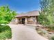 Two-story house exterior with stone accents and landscaping at 3158 S Nepal Way, Aurora, CO 80013