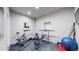 Well-equipped home gym featuring exercise bike, weights, and mats at 3158 S Nepal Way, Aurora, CO 80013