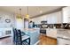 Modern kitchen with stainless steel appliances and granite countertops at 3158 S Nepal Way, Aurora, CO 80013