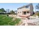 Expansive backyard featuring a patio, a deck, mature trees, and plenty of space for recreation and gardening at 4860 E 120Th Pl, Thornton, CO 80241