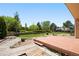 The backyard features a wood deck, landscaping, and generous space for outdoor activities at 4860 E 120Th Pl, Thornton, CO 80241