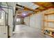 Unfinished basement with concrete flooring, exposed ceiling, with furnace, shelving and a small window at 4860 E 120Th Pl, Thornton, CO 80241