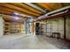 Unfinished basement with exposed beams and ductwork, offering potential for customization and additional living space at 4860 E 120Th Pl, Thornton, CO 80241