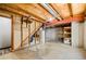 Unfinished basement with exposed wood beams and concrete floor for customizable space at 4860 E 120Th Pl, Thornton, CO 80241