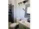 Bathroom features a tiled shower, a modern vanity, and updated fixtures at 4860 E 120Th Pl, Thornton, CO 80241