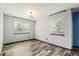 Bedroom with two windows and LVP flooring at 4860 E 120Th Pl, Thornton, CO 80241
