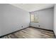 Bedroom featuring luxury vinyl plank flooring and a neutral color scheme at 4860 E 120Th Pl, Thornton, CO 80241