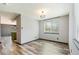 Dining room with LVP flooring and natural light at 4860 E 120Th Pl, Thornton, CO 80241