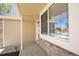 Inviting front porch with brick accents and a convenient security system at 4860 E 120Th Pl, Thornton, CO 80241