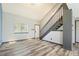 Open living area with luxury vinyl floors and staircase at 4860 E 120Th Pl, Thornton, CO 80241