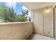 View of exterior with a small outdoor balcony with partial wall and view to the parking lot at 20 S Boulder Cir # 2109, Boulder, CO 80303