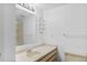 This bathroom has a large mirror, glass shelves, and a shower at 20 S Boulder Cir # 2109, Boulder, CO 80303