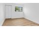 Spacious bedroom featuring a large window, wood-look floors and closet at 20 S Boulder Cir # 2109, Boulder, CO 80303