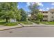 A community sign is surrounded by lush green trees and grass at 20 S Boulder Cir # 2109, Boulder, CO 80303