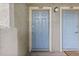 Light blue front door with unit number and door bell located next to another unit door at 20 S Boulder Cir # 2109, Boulder, CO 80303