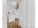Hallway leading to kitchen featuring wood-look flooring and access to closet at 20 S Boulder Cir # 2109, Boulder, CO 80303