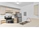 Well-lit kitchen featuring stainless steel appliances, ample cabinet space, and laminate countertops at 20 S Boulder Cir # 2109, Boulder, CO 80303