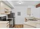 Kitchen featuring stainless steel appliances, wood-look flooring and bright white walls at 20 S Boulder Cir # 2109, Boulder, CO 80303