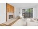 Bright living room with a sliding glass door, neutral furniture, and a fireplace at 20 S Boulder Cir # 2109, Boulder, CO 80303
