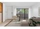 Bright living room with a sliding glass door, neutral furniture, and a fireplace at 20 S Boulder Cir # 2109, Boulder, CO 80303