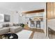 Inviting living room showcasing modern furnishings, a wood accent wall, and an open kitchen at 20 S Boulder Cir # 2109, Boulder, CO 80303