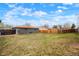 Large back yard with lawn and wooden fence providing ample outdoor space at 13202 Olmsted Pl, Denver, CO 80239
