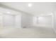 Large, finished basement with plush carpet offers flexible space for recreation and relaxation at 13202 Olmsted Pl, Denver, CO 80239