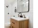 Bathroom features a vanity with modern fixtures, a sleek mirror and a shower at 13202 Olmsted Pl, Denver, CO 80239