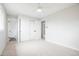Bright bedroom featuring plush carpeting, a ceiling fan, closet and an ensuite bathroom for added convenience at 13202 Olmsted Pl, Denver, CO 80239