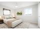 Bright bedroom with large windows, neutral decor, and comfortable furnishings at 13202 Olmsted Pl, Denver, CO 80239