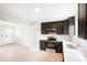 Modern kitchen with stainless steel appliances, dark cabinets, and stylish countertops at 13202 Olmsted Pl, Denver, CO 80239