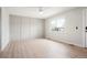 Bright living room featuring a modern ceiling fan, light wood floors, and decorative wall accents at 13202 Olmsted Pl, Denver, CO 80239