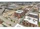 Aerial view of the apartment building in a busy urban neighborhood, highlighting accessibility to transit and nearby destinations at 2229 Blake St # 505, Denver, CO 80205