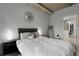 Bright bedroom featuring a large bed, modern decor, and a closet in the doorway at 2229 Blake St # 505, Denver, CO 80205
