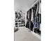 Walk-in closet featuring custom shelves and ample storage space at 2229 Blake St # 505, Denver, CO 80205