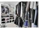 Walk-in closet with custom shelving and ample storage for clothing, shoes, and accessories at 2229 Blake St # 505, Denver, CO 80205