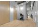 Bright entryway with three doors, shoe rack, light wood floors, and exposed duct work overhead at 2229 Blake St # 505, Denver, CO 80205