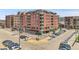 Brick apartment building with balconies above a parking lot, perfect for city living at 2229 Blake St # 505, Denver, CO 80205