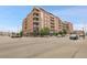 Stylish apartment building featuring brick construction, balconies, and convenient street access at 2229 Blake St # 505, Denver, CO 80205