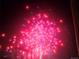 Explosive red and blue fireworks light up the dark sky, a burst of festive celebration at 2229 Blake St # 505, Denver, CO 80205