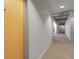 Apartment hallway with a neutral color palette and modern carpet design at 2229 Blake St # 505, Denver, CO 80205