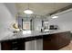 Open floor plan with kitchen island featuring stainless steel appliances, and granite countertops at 2229 Blake St # 505, Denver, CO 80205
