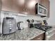Kitchen with granite countertops, a gas range, and stainless appliances at 2229 Blake St # 505, Denver, CO 80205