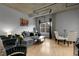 Open concept living room with gray sectional sofa, dining table, and exposed ceiling at 2229 Blake St # 505, Denver, CO 80205