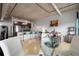 Open concept living space with kitchen, breakfast bar, sitting area, and dining area at 2229 Blake St # 505, Denver, CO 80205