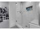 Modern shower featuring white subway tile, a glass door, and a walk-in closet at 2229 Blake St # 505, Denver, CO 80205