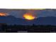 Spectacular sunset behind distant mountains, highlighting the natural beauty of the landscape at 2229 Blake St # 505, Denver, CO 80205
