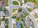 Stunning aerial view of a neighborhood featuring well-maintained homes and lush green landscaping at 5365 W Princeton Dr, Denver, CO 80235