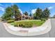 Charming home featuring a well-manicured front lawn, mature trees, and a welcoming entrance at 5365 W Princeton Dr, Denver, CO 80235