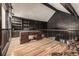 Upper level home office with custom desk, wood floors, dark wood accents and storage at 5365 W Princeton Dr, Denver, CO 80235